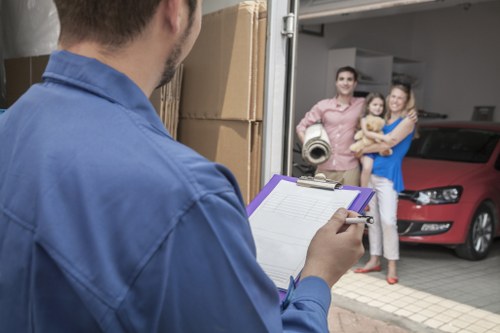 Removal crew moving desks and office furniture safely